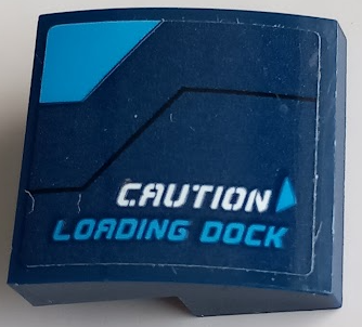 Lego Slope, Curved 2 x 2 x 2/3 with White 'CAUTION', Dark Azure 'LOADING DOCK', Triangle and Stripe Pattern Model Left Side (Sticker) - Set 60196 / Dark Blue