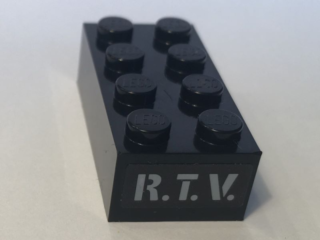 Lego Brick 2 x 4 with Gray 'R.T.V.' Pattern (Sticker) - Set 10274