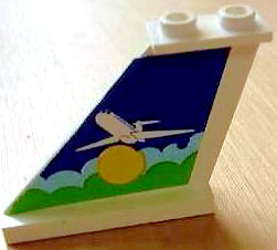 Lego Tail 4 x 1 x 3 with White Airplane over Sun and Clouds Pattern on Left Side (Sticker) - Set 1818