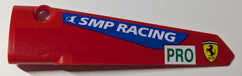 Lego Technic, Panel Fairing # 5 Long Smooth, Side A with White 'SMP RACING' on Blue Stripe, Green 'PRO' on Rectangle and Ferrari Logo Pattern (Sticker) - Set 42125 / Red