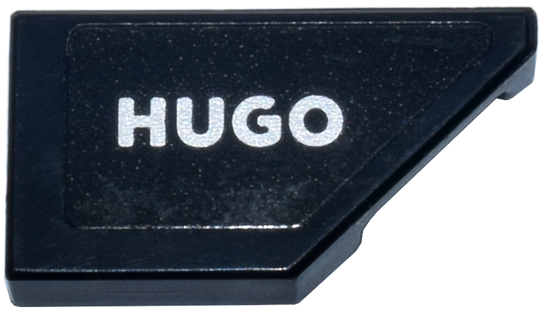 Lego Tile, Modified 1 x 2 Wedge Right with Silver 'HUGO' Logo Pattern (Sticker) - Set 77246