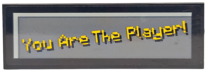 Lego Tile 2 x 6 with Pixelated Bright Light Orange 'You Are The Player!' on Dark Bluish Gray Background Pattern (Sticker) - Set 21265