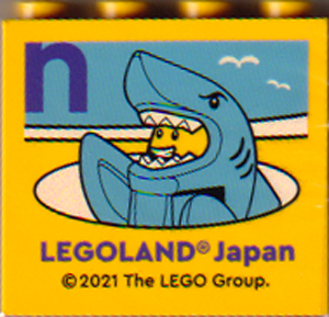 Lego Brick 2 x 4 x 3 with LEGOLAND Japan, Shark Suit Guy Minifigure, and Dark Purple Lowercase Letter n Pattern