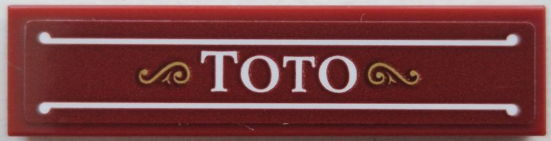 Lego Tile 1 x 4 with White 'TOTO' and Lines, Gold Filigree Pattern (Sticker) - Set 910035