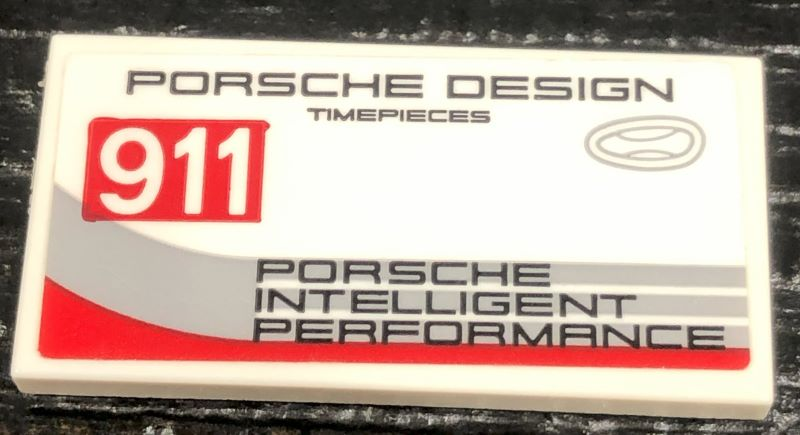 Lego Tile 2 x 4 with '911', 'PORSCHE DESIGN TIMEPIECES' and 'PORSCHE INTELLIGENT PERFORMANCE' Pattern Model Left Side (Sticker) - Set 75888