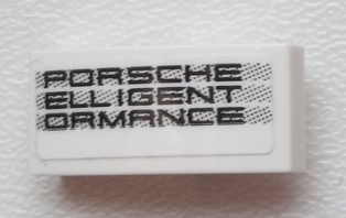 Lego Slope, Curved 2 x 1 x 2/3 with 'PORSCHE ELLIGENT ORMANCE' Pattern Model Right Side (Sticker) - Set 75876