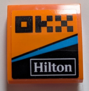 Lego Slope, Curved 2 x 2 with Black Pixelated 'OKX', White 'Hilton' and Dark Azure Stripe Pattern Model Left Side (Sticker) - Set 76919