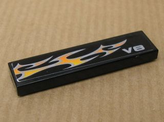 Lego Tile 1 x 4 with 'V8' and White and Orange Flames Pattern Model Left Side (Sticker) - Set 8135 / Black
