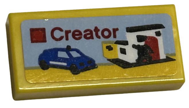 Lego Tile 1 x 2 with LEGO Creator Set Box Art, Blue Car, Police Station, and Black Policeman Minifigure Silhouette Pattern (Sticker) - Sets 40528 / 40574