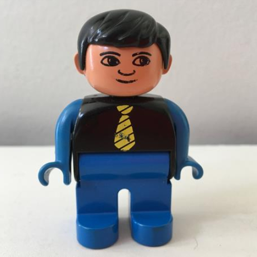 Lego Duplo Figure, Early, with Short Parted Hair Black, Blue Legs, Yellow Tie, Blue Arms, no White in Eyes Print