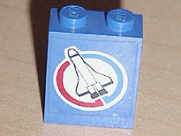 Lego Panel 1 x 2 x 2 - Solid Studs with Space Shuttle and Blue and Red Semicircles on White Circle Background Pattern Model Left Side (Sticker) - Set 6544