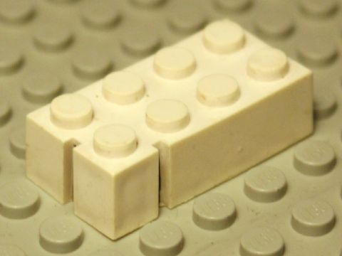Lego Brick 2 x 4 without Bottom Tubes, Slotted (with 2 slots, near corner right)