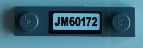 Lego Plate, Modified 1 x 4 with 2 Studs without Groove with 'JM60172' Pattern (Sticker) - Set 60172 / Dark Bluish Gray