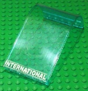 Lego Panel 6 x 6 x 9 Curved Top with White 'INTERNATIONAL' and Thin Lines Pattern (Sticker) - Sets 7894 / Trans-Light Blue