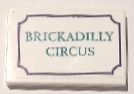 Lego Tile 2 x 3 with Dark Turquoise 'BRICKADILLY CIRCUS' and Dark Purple Border Pattern Model Left Side (Sticker) - Set 41714