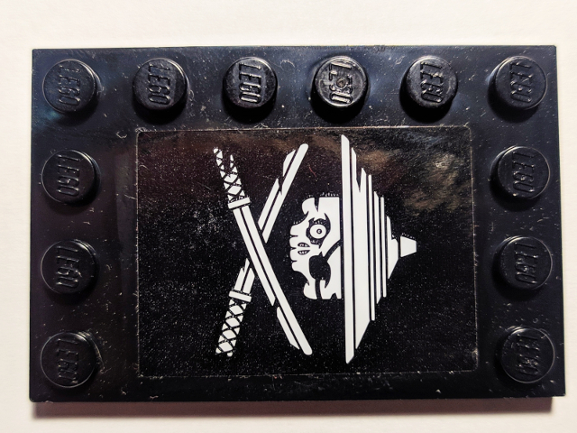 Lego Tile, Modified 4 x 6 with Studs on Edges with White Ninja Skull and Crossed Swords on Black Background Pattern Model Right Side (Sticker) - Set 70605