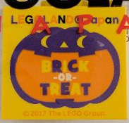 Lego Brick 2 x 4 x 3 with LEGOLAND Japan, 'BRICK-OR-TREAT', and Dark Purple Jack O Lantern with Orange Mouth Pattern / Yellow