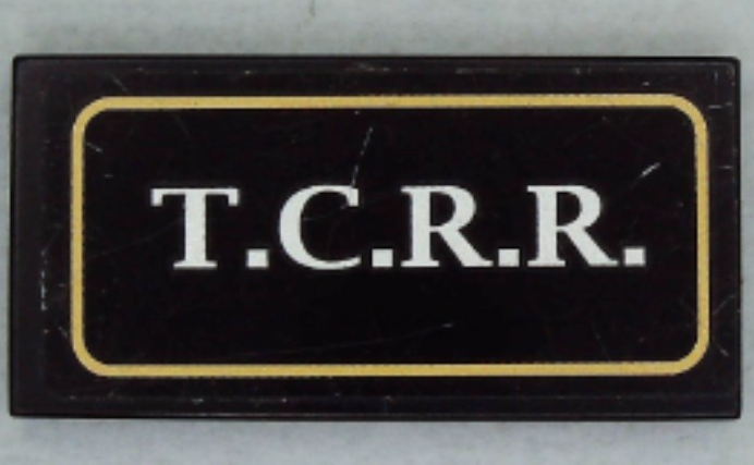 Lego Tile 2 x 4 with White 'T.C.R.R.' in Gold Border Pattern (Sticker) - Set 79111 / Black