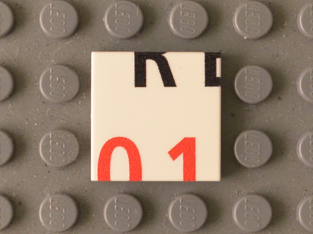 Lego Tile 2 x 2 with Black 'RE' Lower Half and Red '01' Upper Half Pattern / White