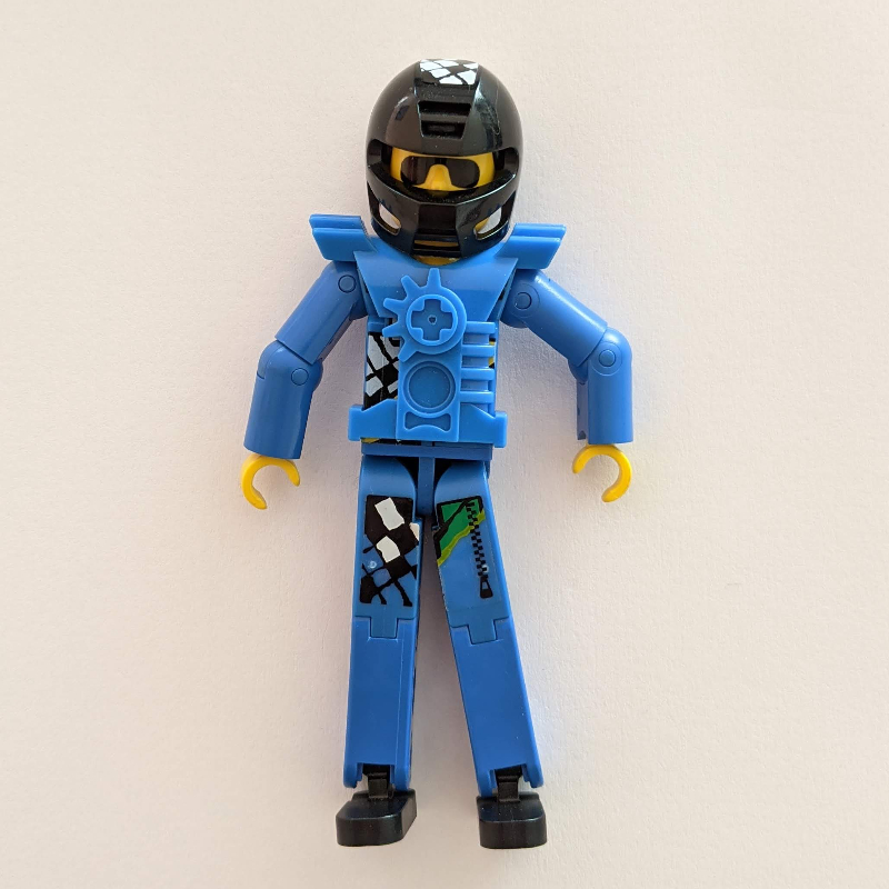 Lego Technic Figure Blue Legs, Blue Top with Technic Logo, Black Hair and Sunglasses - Black Helmet