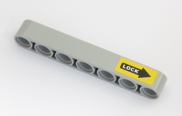 Lego Technic, Liftarm Thick 1 x 7 with White 'LOCK' on Black Arrow on Yellow Background Pattern (Sticker) - Set 42043
