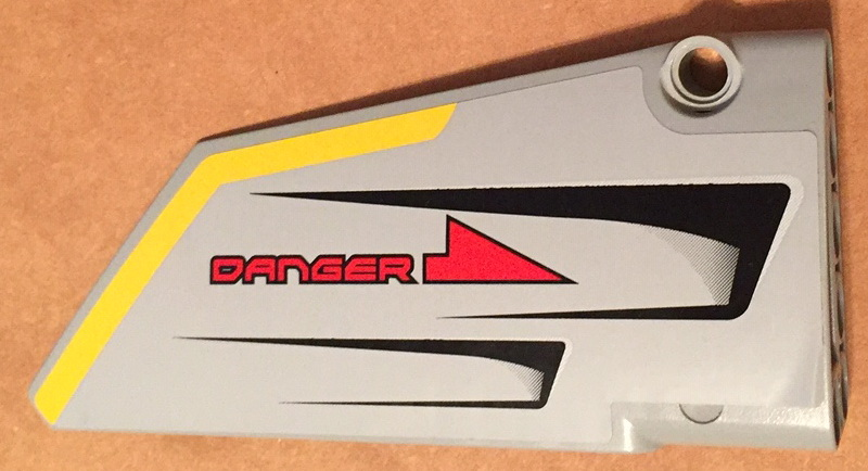 Lego Technic, Panel Fairing #18 Large Smooth, Side B with Red 'DANGER', Black Vents and Yellow Stripe on Edge Pattern (Sticker) - Set 7160 / Light Bluish Gray