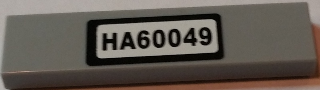 Lego Tile 1 x 4 with Black 'HA60049' Pattern (Sticker) - Set 60049
