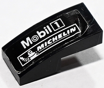 Lego Slope, Curved 2 x 1 x 2/3 with White Mobil 1 and Michelin Logo Pattern Model Right Side (Sticker) - Set 75888 / Black