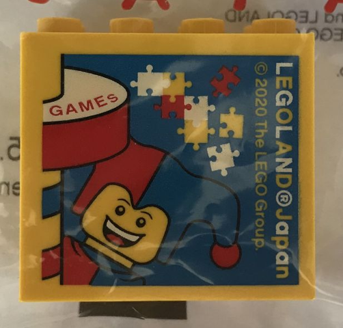 Lego Brick 2 x 4 x 3 with LEGOLAND Japan, 'GAMES', Jester Minifigure, and Puzzle Pieces Pattern