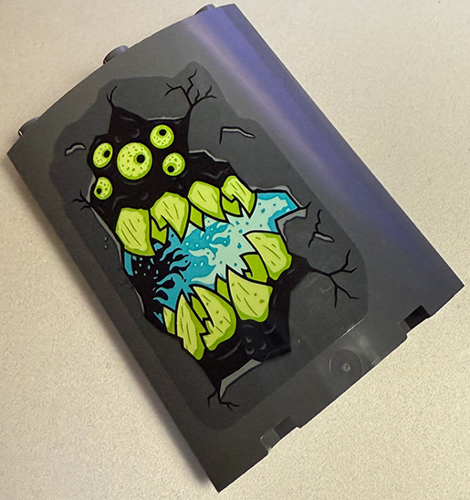 Lego Cylinder Quarter 4 x 4 x 6 with Lime and Yellowish Green Monster Eyes and Teeth, Black Cracks and Medium Azure Lava Pattern Model Right Side (Sticker) - Set 70437
