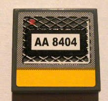 Lego Tile 2 x 2 with Black 'AA 8404' on Grille and Yellow Line Pattern (Sticker) - Set 8404