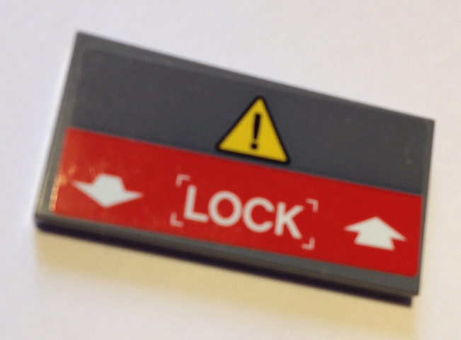 Lego Tile 2 x 4 with Yellow Triangle with Exclamation Mark, White Arrows and 'LOCK' on Red Background Pattern (Sticker) - Set 60125 / Dark Bluish Gray