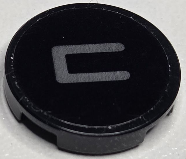 Lego Tile, Round 2 x 2 with Bottom Stud Holder with Dark Bluish Gray Capital Letter C Pattern (Sticker) - Set 40769 / Black