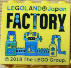 Lego Brick 2 x 4 x 3 with LEGOLAND Japan, Black 'FACTORY', and Green, Blue, and Medium Blue Machine Pattern