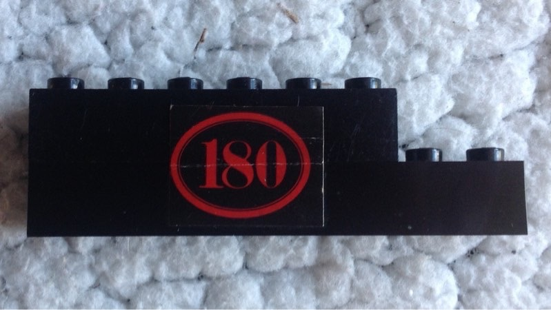 Lego Stickered Assembly 8 x 1 x 2 with Red '180' with Oval Border on Black Background Pattern Model Right Side (Sticker) - Set 180