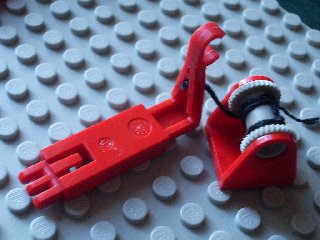 Lego String Reel 2 x 2 Holder with Light Gray Drum with Black String and Red Hook Slider (2584 / 2585 / x77 / 2651c01)