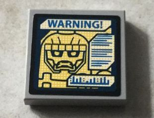 Lego Tile 2 x 2 with Sentinel Face and Blue 'WARNING! on Screen Pattern (Sticker) - Set 76022