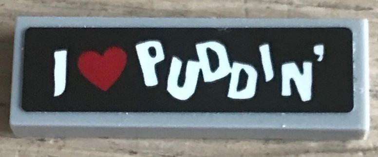 Lego Tile 1 x 3 with 'I Heart PUDDIN' on Black Background Pattern (Sticker) - Set 70921