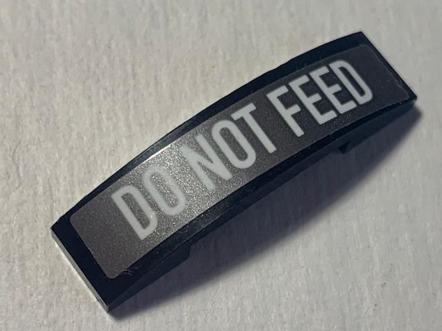Lego Slope, Curved 4 x 1 x 2/3 Double with 'DO NOT FEED' Pattern (Sticker) - Set 70613 / Black