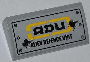 Lego Slope, Curved 2 x 4 x 2/3 with Bottom Tubes with 'ADU ALIEN DEFENCE UNIT' Pattern (Sticker) - Set 7066