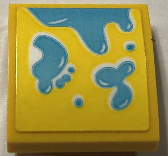 Lego Slope, Curved 2 x 2 x 2/3 with Medium Azure Water Splashes and Footprint Pattern Model Left Side (Sticker) - Set 41720 / Yellow