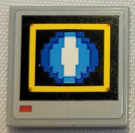 Lego Tile 2 x 2 with Pixelated Blue and White Circle in Yellow Square on Black Background Pattern (Sticker) - Set 21331 (Sonic the Hedgehog Shield Video Monitor) / Light Bluish Gray