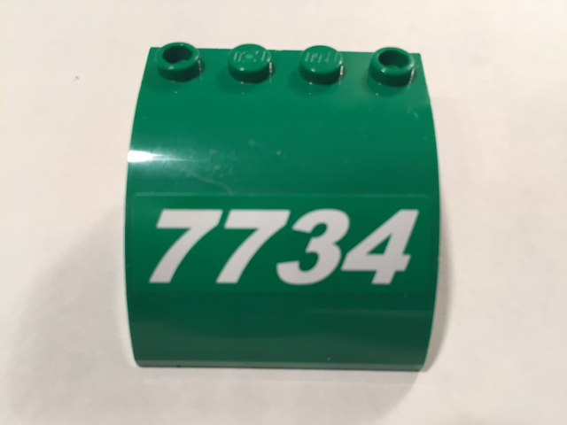 Lego Slope, Curved 4 x 4 x 2 with 4 Studs and Pin Holes with White Slanting '7734' Pattern Model Left Side (Sticker) - Set 7734