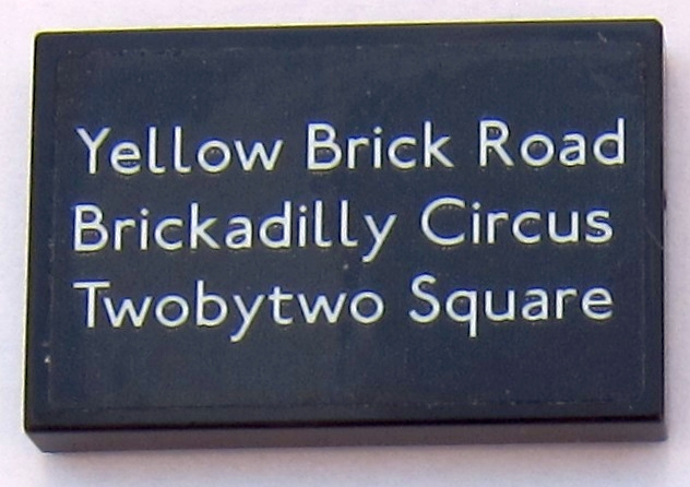 Lego Tile 2 x 3 with White 'Yellow Brick Road', 'Brickadilly Circus', and 'Twobytwo Square' Pattern (Sticker) - Set 10258
