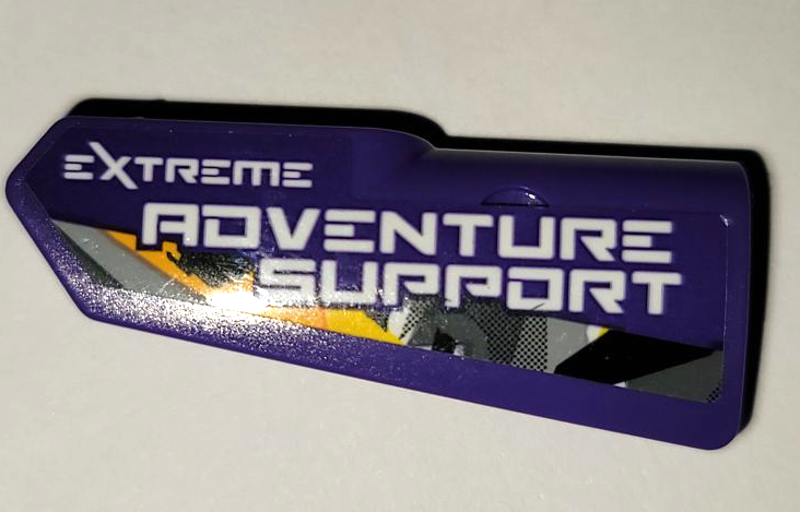 Lego Technic, Panel Fairing #22 Very Small Smooth, Side A with White 'EXTREME ADVENTURE SUPPORT' and Geometric Stripe Pattern (Sticker) - Set 42069 / Dark Purple