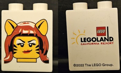 Lego Duplo, Brick 1 x 2 x 2 with Tiger Woman Minifigure Head (Halloween / Brick or Treat) and LEGOLAND CALIFORNIA RESORT Pattern