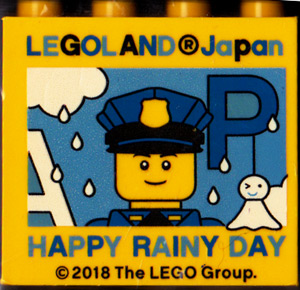 Lego Brick 2 x 4 x 3 with LEGOLAND Japan, 'HAPPY RAINY DAY', Policeman Minifigure, and Blue Capital Letter P Pattern