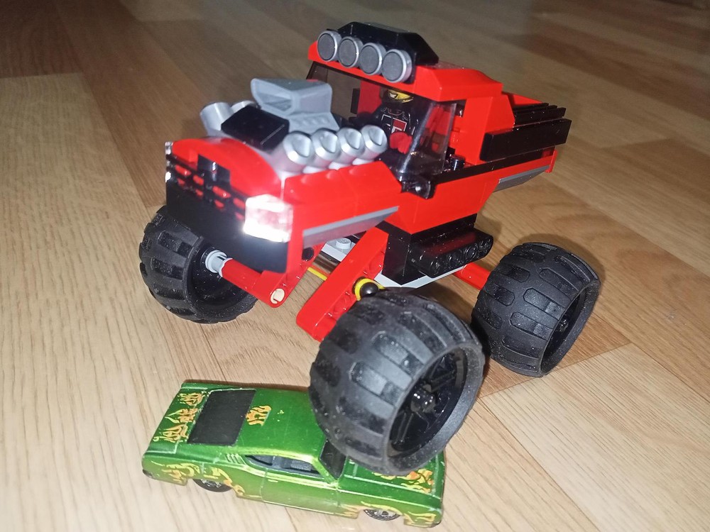 Lego Red bigfoot pickup truck with suspension