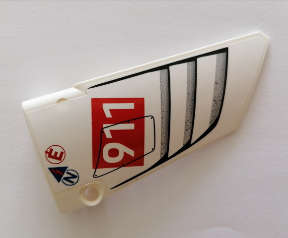 Lego Technic, Panel Fairing #18 Large Smooth, Side B with White '911' on Red Rectangle, Vents, Red Letter E, Blue Letter N Pattern (Sticker) - Set 42096 / White