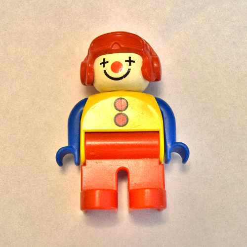 Lego Duplo Figure, Early, Aviator Hat Red, Red Legs, with 2 Buttons, Blue Arms, Clown Face Paint / Yellow